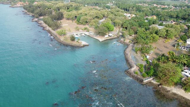 Tropical resort in paradise island landscape. Beautiful Anyer Beach in Indonesia with trees and white sand. Resort on the shores of the Indian Ocean.