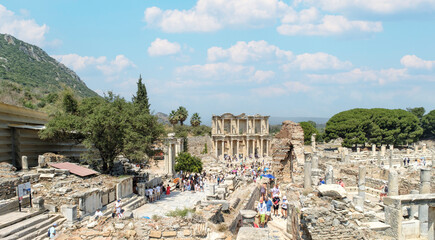 Photo of Celsius library and marble columns in the ephesus ancient city . Cultural and historical tourism concept. Efes Izmir Turkey.