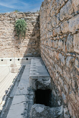 Ancient public Toilet bathroom seats on Ephesus , public toilets used in ancient times, sitting toilets side by side