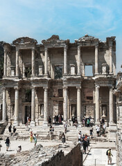 Photo of Celsius library and marble columns in the ephesus ancient city . Cultural and historical tourism concept. Efes Izmir Turkey.
