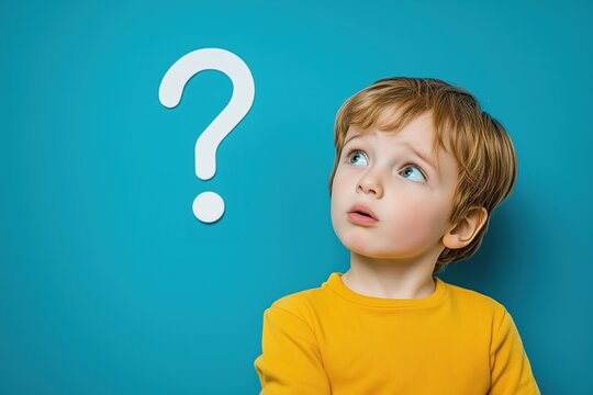 boy next to a question mark