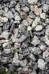 A pile of rocks with a gray and white color