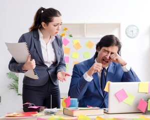 Two colleagues employees working in the office