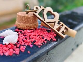 love on small red stones with shells
