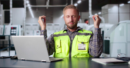 Factory Engineer Meditation At Industrial Facility
