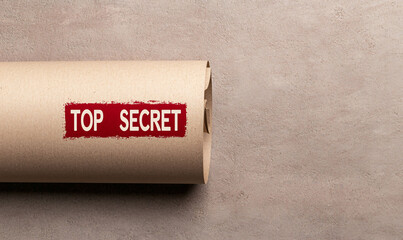 Top secret document rolled up, symbolizing confidentiality and classified information. This image evokes sense of mystery and importance in communication