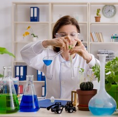 Old female biotechnology chemist working in the lab