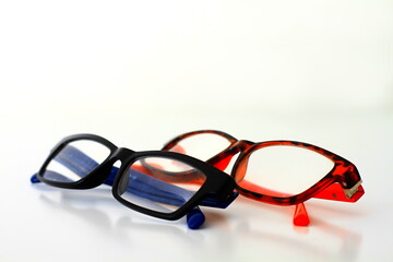 reading glasses on display on a table at an optician shop no people on white background stock image stock photo