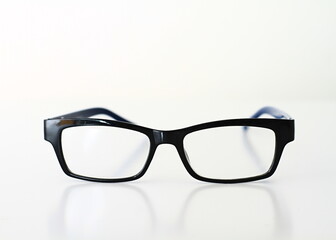 reading glasses on display on a table at an optician shop no people on white background stock image stock photo