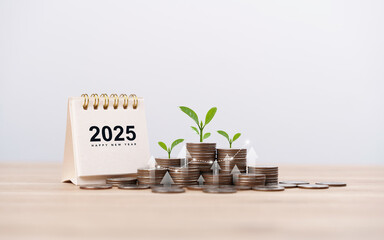 Calendar happy new year 2025 with  graph and stack of growth coins. financial annual plan for save...
