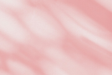 Light and shadow pink pastel abstract background. Natural leaves shadows and sunshine diagonal...