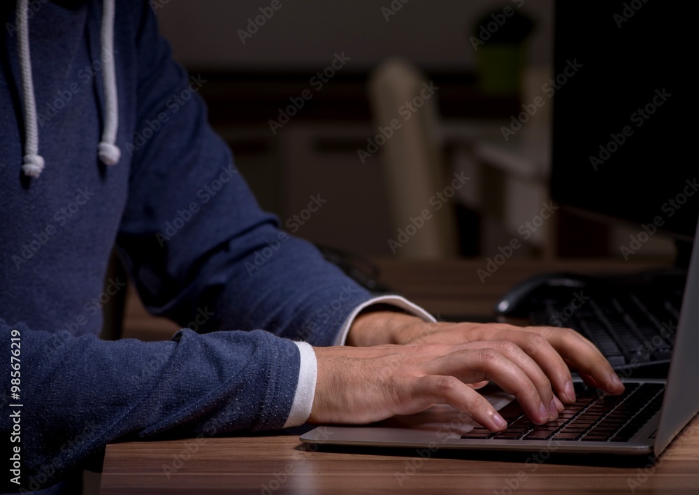 Poster male hacker hacking security firewall late in office