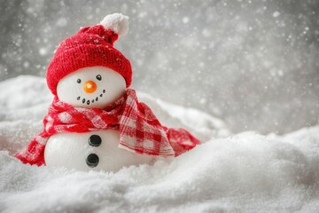 Fototapeta premium Cheerful snowman with red hat scarf in snowy scene