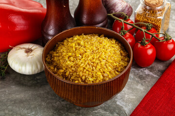 Dry wheat bulgur cereal heap