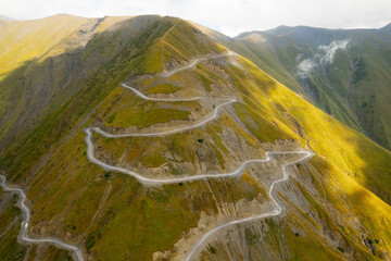 Aerial view of mountain winding road in Tusheti, Georgia. Abano pass. One of the most dangerous road on the world. High quality photo