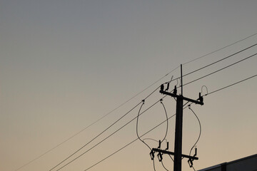 silhouette electric pole on sky sunset