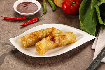 Vietnamese stuffed spring roll served sauce