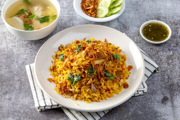 chicken biryani dish served on a table