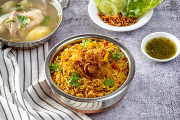 Chicken biryani in Bowl served on a table
