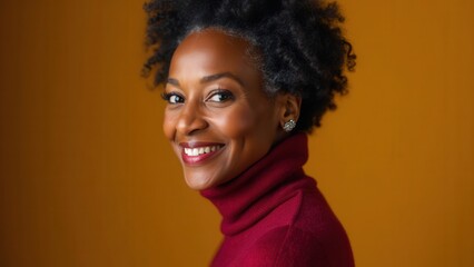 A confident woman with natural curly hair showcases her joyful expression while dressed in a stylish turtleneck. The warm colors of the background enhance the inviting atmosphere, radiating positivity