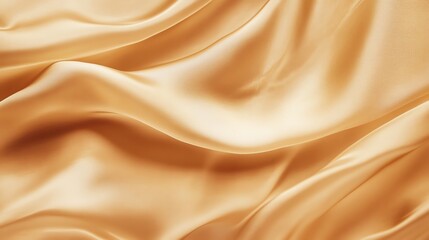 Obraz premium Soft golden silk fabric with elegant waves, perfect for backgrounds, fashion designs, or luxurious decor.