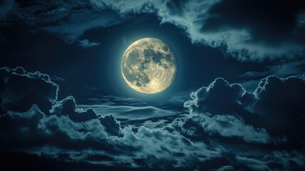 Full moon illuminated by dramatic clouds in a night sky with a mystical atmosphere
