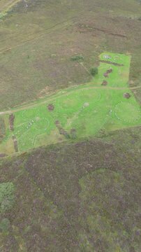 Aerial view of a group of women worshipping at the Beaghmore Stone circles at Blackrock Road by Cookstown in County Tyrone, Northern Ireland