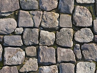 Obraz premium A stone wall with moss growing on it