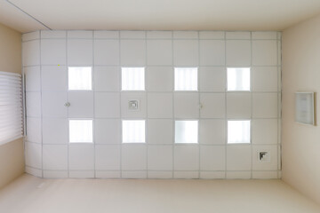 cassette stretched or suspended ceiling with square halogen spots lamps and drywall construction in...