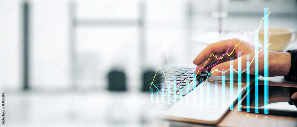 Poster closeup of a man analyzing financial data on a laptop with graphs on screen, modern office backgroun