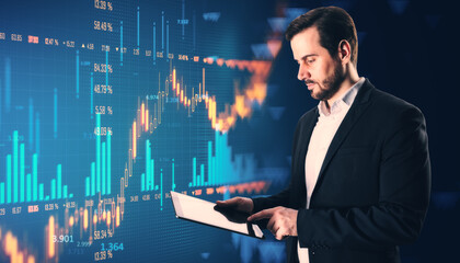 Businessman analyzing digital financial chart data on a tablet.