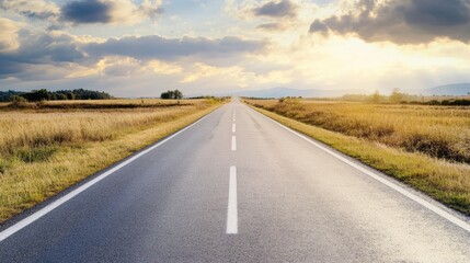 Fototapeta premium A wide open road stretching into the horizon, symbolizing freedom and adventure.
