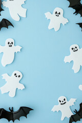 Empty Halloween picture frame on color background with bats, ghosts and pumpkin