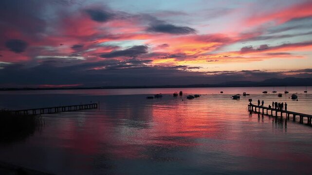 Panoramic lakeview at sunset from lakeside walkway at Pacengo, Lazise, Lake Garda, Italy
