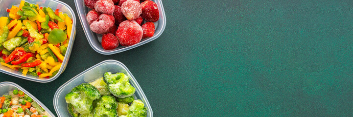 Preparing food for the winter, freezing fresh vegetables in the summer in the refrigerator, various frozen vegetables in plastic dishes on a green background, banner