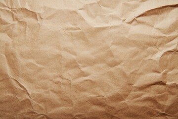 Obraz premium A textured brown paper surface with visible crumples and folds, perfect for backgrounds or texture overlays.