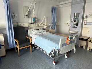 hospital ward room with medical bed