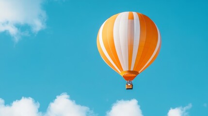 Naklejka premium Orange and White Hot Air Balloon Soaring in the Sky, symbolizes freedom, adventure, exploration, travel, and joy.