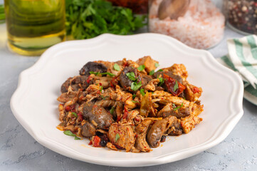 Fototapeta premium Sauteed chicken dish with mushrooms
