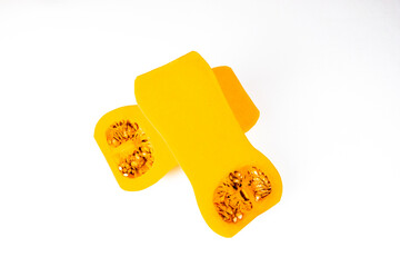 Two halves of an Butternut Squash (Cucurbita moschata) on white  background. Autumn vegetables for proper nutrition.