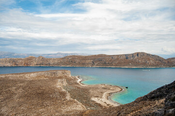 Beautiful Mediterranean summer landscape, bird's eye view. Mountains and rocks, turquoise water in the bay. Gramvousa island, Crete, Greece.