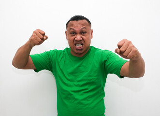 Portrait of an angry Asian man on white isolated backgrund