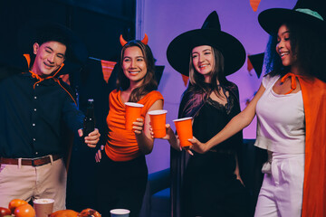 Joyful office Halloween party with coworkers in costumes, celebrating with drinks and laughter, fostering teamwork and festive spirit