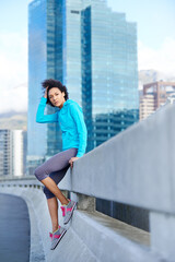 Woman, cardio and break in city for running, sports or training on street or road. Health, jogging and runner portrait or female athlete getting ready for fitness, marathon or exercise with smile