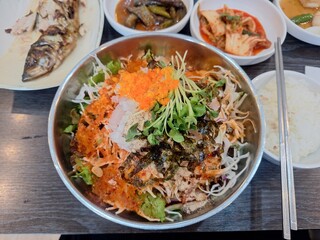 A Korean dish called Mulhoe, which is a spicy raw fish soup