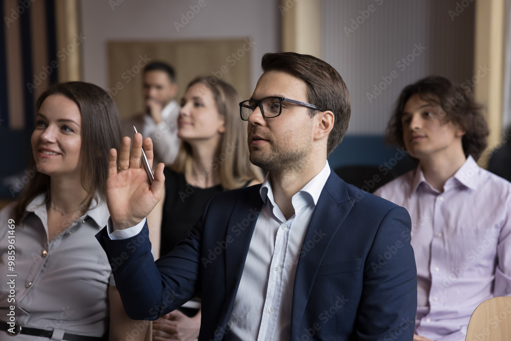 Poster confident businessman asking question to speaker on business conference, training, raising hands. au