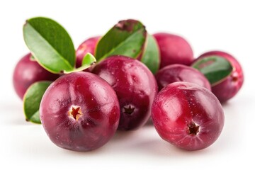 Plums and leaves arranged on a white background
