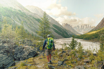 Fototapeta premium hiker man walking in the wild mountains