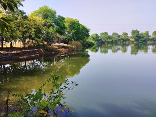 the view of the quiet lake in a very beautiful environment