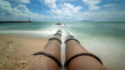 Concrete Pipes Extending into the Sea
